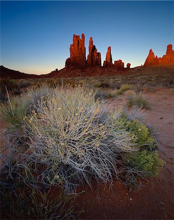 simsearch:6119-08740813,k - Sandstone formations in evening light with scrub in foreground, Monument Valley Tribal Park, Arizona, United States of America, North America Stock Photo - Premium Royalty-Free, Code: 6119-08266406