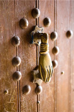 Brass Hand of Fatima door knocker, a popular symbol in Southern Morocco, Merzouga, Morocco, North Africa, Africa Stock Photo - Premium Royalty-Free, Code: 6119-08266505