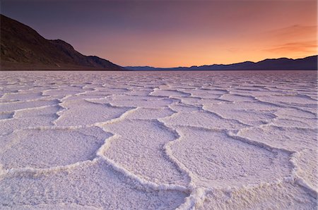 Sunset at the Salt pan polygons, Badwater Basin, 282ft below sea level and the lowest place in North America, Death Valley National Park, California, United States of America, North America Stock Photo - Premium Royalty-Free, Code: 6119-08267431