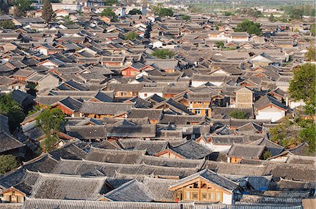 Crowded rooftops in Lijiang Old Town, UNESCO World Heritage Site, Yunnan Province, China, Asia Stock Photo - Premium Royalty-Free, Code: 6119-08267887