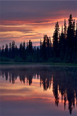 Sunset at an unnamed lake near Salmo Lake, Alaska Highway, Yukon Territory, Canada, North America Stock Photo - Premium Royalty-Free, Code: 6119-08268979