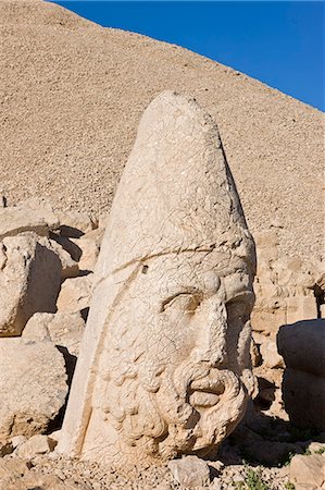 Ancient carved stone heads of the gods, head of Zeus, Nemrut Dagi (Nemrut Dag), on the summit of Mount Nemrut, UNESCO World Heritage Site, Anatolia, Turkey, Asia Minor, Eurasia Stock Photo - Premium Royalty-Free, Code: 6119-08269367