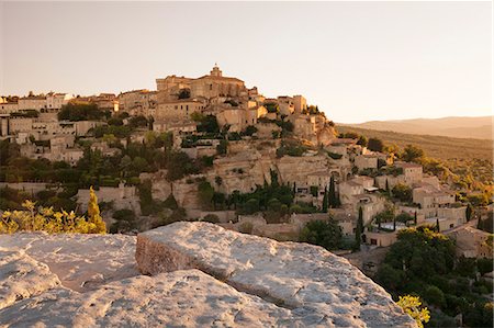 Hilltop village of Gordes with castle and church at sunrise, Provence, Provence-Alpes-Cote d'Azur, Southern France, France, Europe Stock Photo - Premium Royalty-Free, Code: 6119-08351211