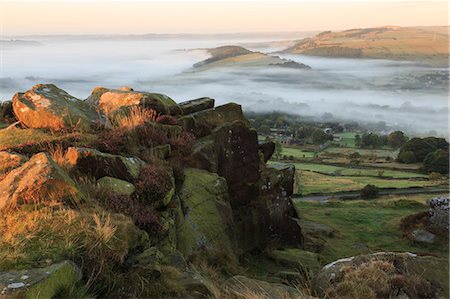 peak district - Mist folds over Curbar village, fields and woods from Curbar Edge with heather, autumn dawn, Peak District, Derbyshire, England, United Kingdom, Europe Stock Photo - Premium Royalty-Free, Code: 6119-08351215