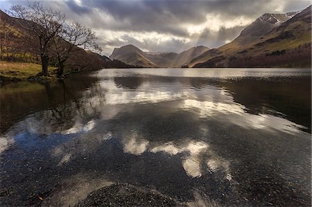 simsearch:6119-09074465,k - Winter reflections, shafts of sunlight break through clouds, Buttermere, Lake District National Park, Cumbria, England, United Kingdom, Europe Stock Photo - Premium Royalty-Free, Code: 6119-08351219