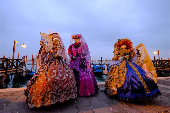 Masks and costumes at St. Mark's Square during Venice Carnival, Venice, Veneto, Italy, Europe Stock Photo - Premium Royalty-Free, Image code: 6119-08420477
