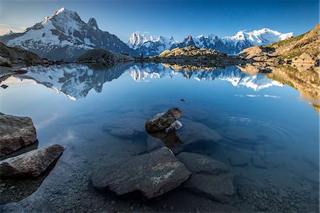Snowy peaks of Aiguilles Verte, Dent Du Geant, and Mont Blanc are reflected in Lac Blanc, Haute Savoie, French Alps, France, Europe Stock Photo - Premium Royalty-Free, Code: 6119-08420437