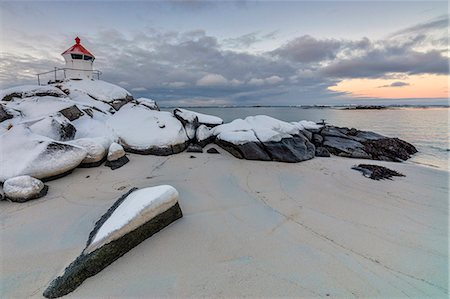 Colorful arctic sunset on the lighthouse surrounded by snow and icy sand, Eggum, Vestvagoy (Vest-Vagoy) Island, Lofoten Islands, Arctic, Norway, Scandinavia, Europe Stock Photo - Premium Royalty-Free, Code: 6119-08641098