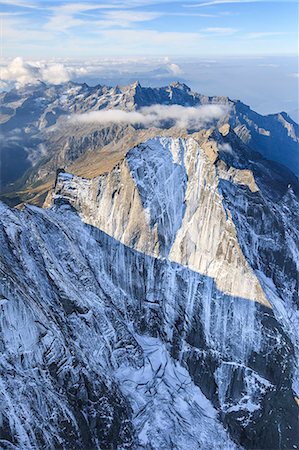 simsearch:6119-08797353,k - Aerial view of the north face of Piz Badile located between Masino and Bregaglia Valley, border of Italy and Switzerland, Europe Foto de stock - Sin royalties Premium, Código: 6119-08641116
