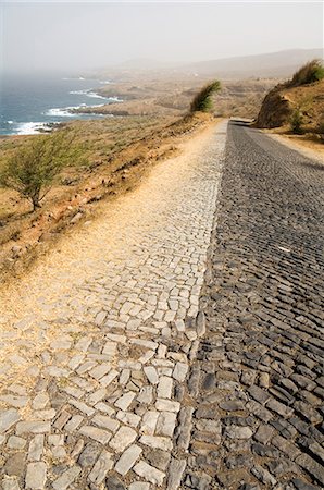 Cobblestone road on north coast of Santiago, Cape Verde Islands, Atlantic Ocean, Africa Fotografie stock - Premium Royalty-Free, Codice: 6119-08740161