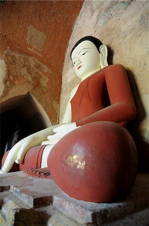 Sitting Buddha in a temple in the ruined town of Bagan, Myanmar, Asia Stock Photo - Premium Royalty-Free, Code: 6119-08741745