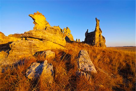 Rock formation shimmering golden at sunset in the Isalo National Park, Madagascar, Africa Stock Photo - Premium Royalty-Free, Code: 6119-08741717