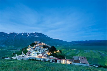 snow on grass - Dusk on the medieval village surrounded by green fields, Castelluccio di Norcia, Province of Perugia, Umbria, Italy, Europe Stock Photo - Premium Royalty-Free, Code: 6119-08797173