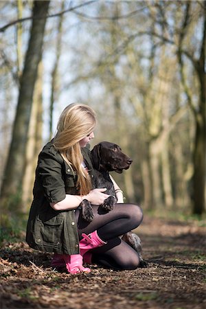 pointer dogs sitting - A girl takes her German short-haired pointer for a walk in woods near Ashmore in Dorset, England, United Kingdom, Europe Stock Photo - Premium Royalty-Free, Code: 6119-08797399