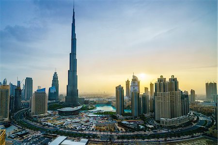 famous modern architecture buildings - Burj Khalifa and Downtown Dubai at sunset, Dubai, United Arab Emirates, Middle East Stock Photo - Premium Royalty-Free, Code: 6119-08797440