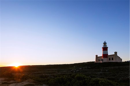 simsearch:6119-09074312,k - Agulhas lighthouse at southernmost tip of Africa at sunset, Agulhas National Park, Western Cape, South Africa, Africa Stockbilder - Premium RF Lizenzfrei, Bildnummer: 6119-08797475