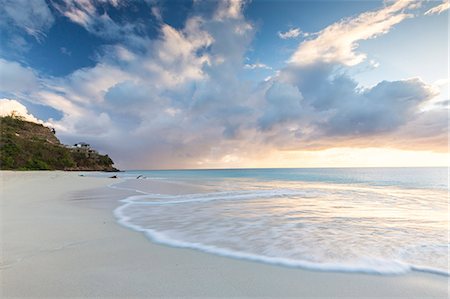 simsearch:6119-07541602,k - The sky turns pink at sunset and reflected on Ffryes Beach, Antigua, Antigua and Barbuda, Leeward Islands, West Indies, Caribbean, Central America Stock Photo - Premium Royalty-Free, Code: 6119-08703668