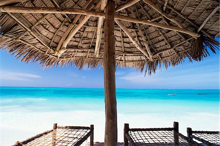 Beach parasol overlooking Indian Ocean, Jambiani beach, island of Zanzibar, Tanzania, East Africa, Africa Stock Photo - Premium Royalty-Free, Code: 6119-08739985