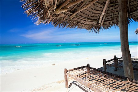 simsearch:851-02963338,k - Beach parasol overlooking Indian Ocean, Jambiani beach, island of Zanzibar, Tanzania, East Africa, Africa Stock Photo - Premium Royalty-Free, Code: 6119-08739986