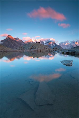 swiss alps sunset - Pink clouds at sunset on Piz Bernina, Fuorcla Surlej, Corvatsch, Engadine, Canton of Graubunden, Swiss Alps, Switzerland, Europe Stock Photo - Premium Royalty-Free, Code: 6119-09054057