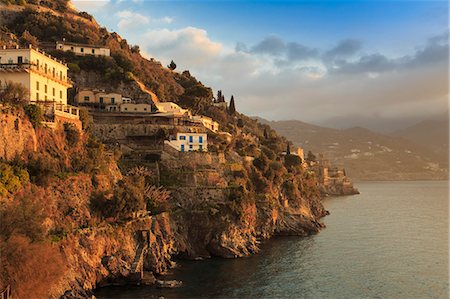 Sunrise lights up villas, misty dawn on the Amalfi Coast, near Atrani in spring, UNESCO World Heritage Site, Campania, Italy, Europe Stock Photo - Premium Royalty-Free, Code: 6119-09073903