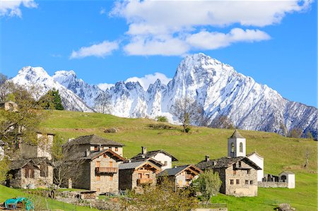 europe landmark not people - Alpine village and meadows framed by the snowy peak of Pizzo di Prata, Daloo, Chiavenna Valley, Valtellina, Lombardy, Italy, Europe Stock Photo - Premium Royalty-Free, Code: 6119-09074193