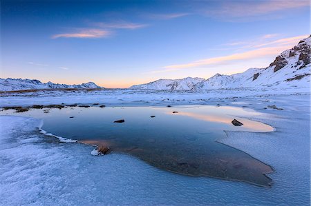 simsearch:6119-09074125,k - Pink clouds at dawn on the alpine Lake, Piz Umbrail surrounded by snowy peaks, Braulio Valley, Valtellina, Lombardy, Italy, Europe Photographie de stock - Premium Libres de Droits, Code: 6119-09074139