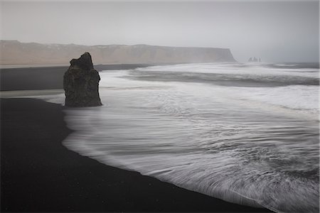 simsearch:6119-09074457,k - Reynisdrangar basalt rock columns and black sand beach in Vik, Iceland, Polar Regions Stock Photo - Premium Royalty-Free, Code: 6119-09074457