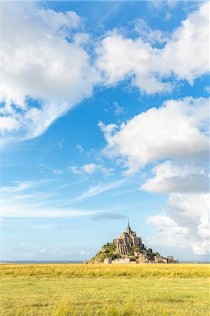 Clouds in the sky and grass in the foreground, Mont-Saint-Michel, UNESCO World Heritage Site, Normandy, France, Europe Stock Photo - Premium Royalty-Free, Code: 6119-09074605