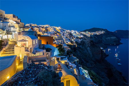 simsearch:6119-09239088,k - The view from Oia castle along Santorini's caldera during the evening blue hour with the buildings lit, Santorini, Cyclades, Greek Islands, Greece, Europe Stock Photo - Premium Royalty-Free, Code: 6119-09074628