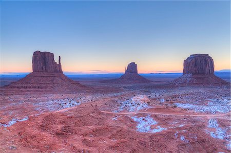 Sunrise, West Mitten Butte on left, East Mitten Butte in centre, and Merrick Butte on right, Monument Valley Navajo Tribal Park, Utah, United States of America, North America Stock Photo - Premium Royalty-Free, Code: 6119-09074935