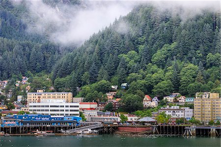 Juneau, State Capital, view from the sea, mist clears over downtown buildings, mountains, forest and float planes, Alaksa, United States of America, North America Stock Photo - Premium Royalty-Free, Code: 6119-09085505