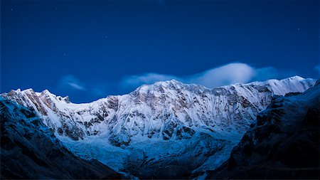 simsearch:6119-08797376,k - Clouds and stars at night over Annapurna, image taken from Base Camp in the Sanctuary, Himalayas, Nepal, Asia Foto de stock - Sin royalties Premium, Código: 6119-09147320