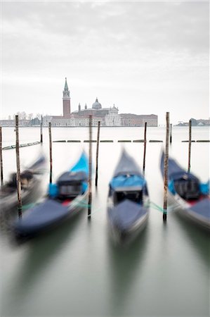 Gondolas with the Church of San Giorgio Maggiore in the background, Venice, UNESCO World Heritage Site, Veneto, Italy, Europe Stock Photo - Premium Royalty-Free, Code: 6119-09156559