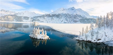 Aerial panoramic view of Lake Sils and Plaun da Lej during winter, Maloja Region, Canton of Graubunden, Engadine, Switzerland, Europe (Drone) Stock Photo - Premium Royalty-Free, Code: 6119-09161658