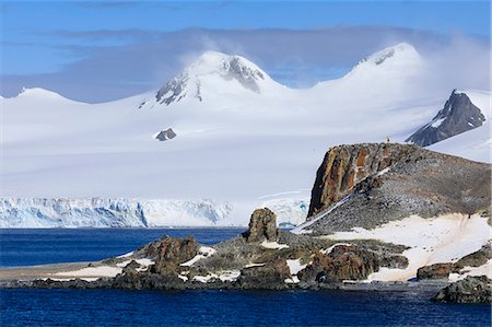 Distant penguins on Half Moon Island, Livingston Island in mist, evening sun, South Shetland Islands, Antarctica, Polar Regions Foto de stock - Sin royalties Premium, Código: 6119-09161608