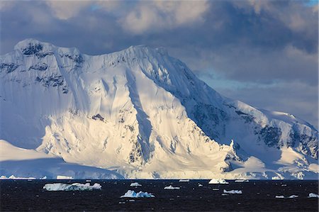 Gerlache Strait mountains, glaciers and icebergs, late evening before sunset, Antarctic Peninsula, Antarctica, Polar Regions Stock Photo - Premium Royalty-Free, Code: 6119-09161620