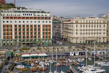 Promenade view from Ovo Castle of waterfront with hotels, and marina landscape seen from Castel dell Ovo islet fortress, Naples, Campania, Italy, Europe Photographie de stock - Premium Libres de Droits, Code: 6119-09161798