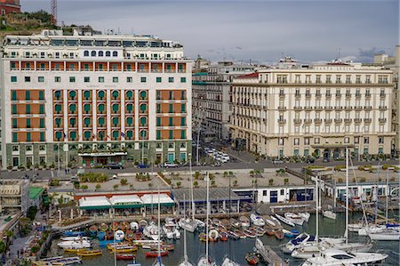 Promenade view from Ovo Castle of waterfront with hotels, and marina landscape seen from Castel dell Ovo islet fortress, Naples, Campania, Italy, Europe Stock Photo - Premium Royalty-Free, Code: 6119-09161798