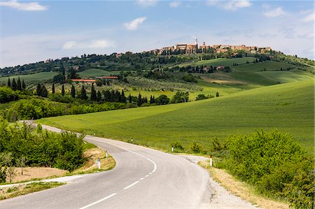 Tuscan road winding through green fields towards Pienza, Tuscany, Italy, Europe Stock Photo - Premium Royalty-Free, Code: 6119-09161827