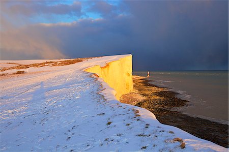 Snow covered Beachy Head and Lighthouse, Eastbourne Downland Estate, Eastbourne, East Sussex, England, United Kingdom, Europe Stock Photo - Premium Royalty-Free, Code: 6119-09169983