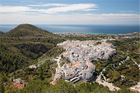 View over white Andalucian village to the sea, Frigiliana, Malaga Province, Costa del Sol, Andalucia, Spain, Europe Stock Photo - Premium Royalty-Free, Code: 6119-09170358