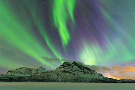 dramatic lighting - Northern Lights (Aurora borealis) on frozen lake Skoddebergvatnet, Grovfjord, Troms county, Lofoten Islands, Nordland, Norway, Europe Stock Photo - Premium Royalty-Free, Code: 6119-09182539