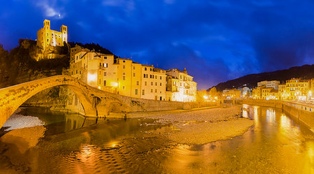 Lights reflected in the river during twilight, Dolceacqua, Province of Imperia, Liguria, Italy, Europe Stock Photo - Premium Royalty-Free, Code: 6119-09182716