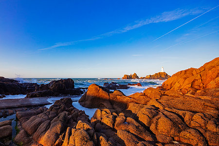 rough sea and nobody - Corbiere Point Lighthouse, Jersey, Channel Islands, United Kingdom, Europe Stock Photo - Premium Royalty-Free, Code: 6119-09182845