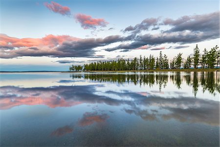 simsearch:6119-09170151,k - Fir trees and clouds reflecting on the suface of Hovsgol Lake at sunset, Hovsgol province, Mongolia, Central Asia, Asia Foto de stock - Royalty Free Premium, Número: 6119-09101850