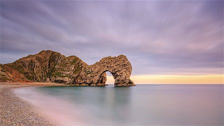 simsearch:6119-07943831,k - Dusk descends at Durdle Door on the Jurassic Coast, UNESCO World Heritage Site, Dorset, England, United Kingdom, Europe Foto de stock - Sin royalties Premium, Código: 6119-09126965