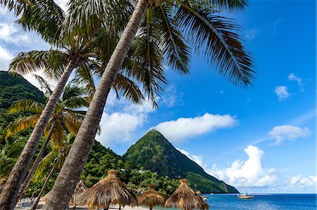 Gros Piton, with palm trees and thatched sun umbrellas, Sugar Beach, St. Lucia, Windward Islands, West Indies Caribbean, Central America Stock Photo - Premium Royalty-Free, Code: 6119-09127140