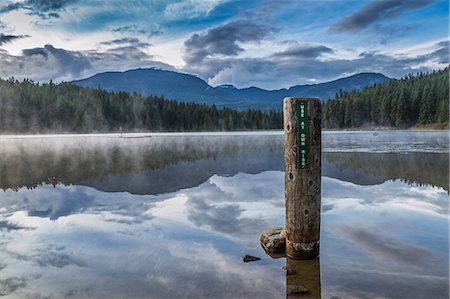 Mist on Lost Lake, Ski Hill and surrounding forest, Whistler, British Columbia, Canada, North America Stock Photo - Premium Royalty-Free, Code: 6119-09127150