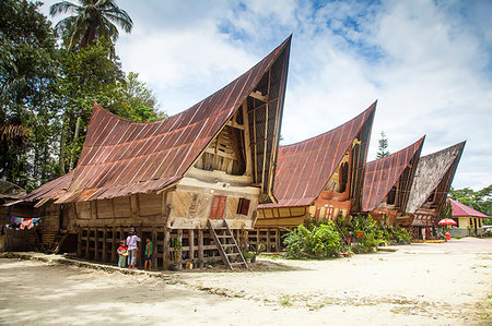 photos beach boys in asia - Traditional Batak wooden houses, Tomok, Lake Toba, Samosir Island, Sumatra, Indonesia, Southeast Asia, Asia Stock Photo - Premium Royalty-Free, Code: 6119-09252574
